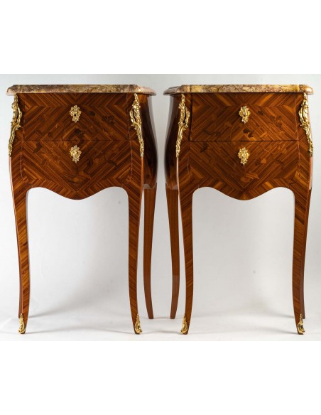 A Pair of bedside tables in Louis XV style.