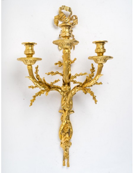 A Pair of wall-lights in Louis XVI style dated 1881.