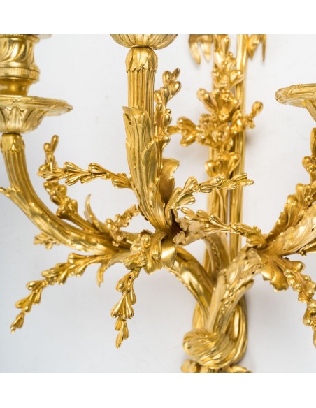 A Pair of wall-lights in Louis XVI style dated 1881.