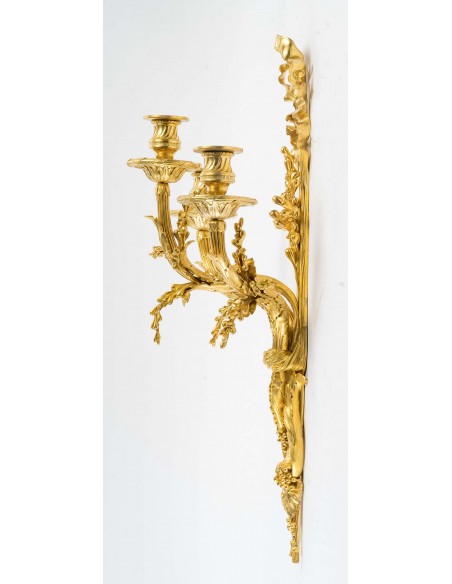 A Pair of wall-lights in Louis XVI style dated 1881.