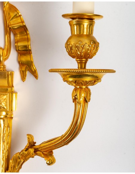 A pair of wall lights in the Louis XVI style. 19th century.