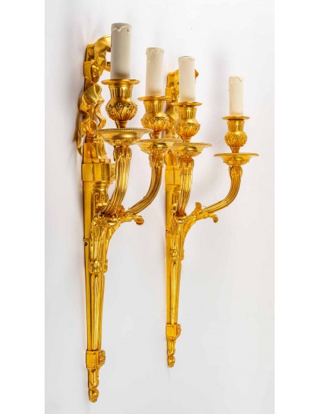 A pair of wall lights in the Louis XVI style. 19th century.