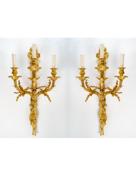 A Pair of wall-lights in Louis XVI style dated 1881.