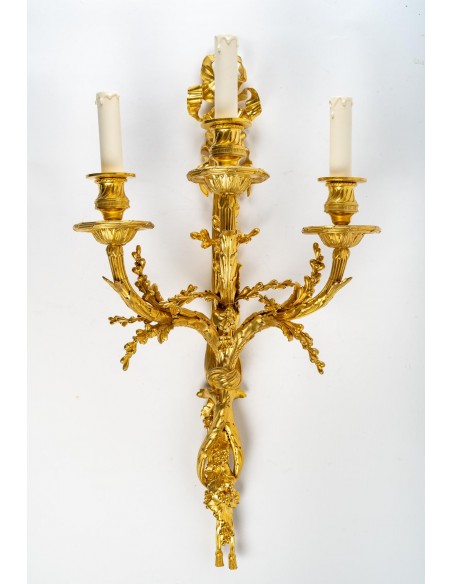 A Pair of wall-lights in Louis XVI style dated 1881.