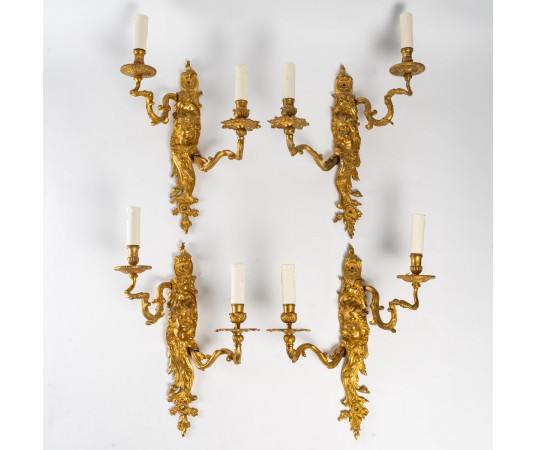 Suite de quatre appliques...