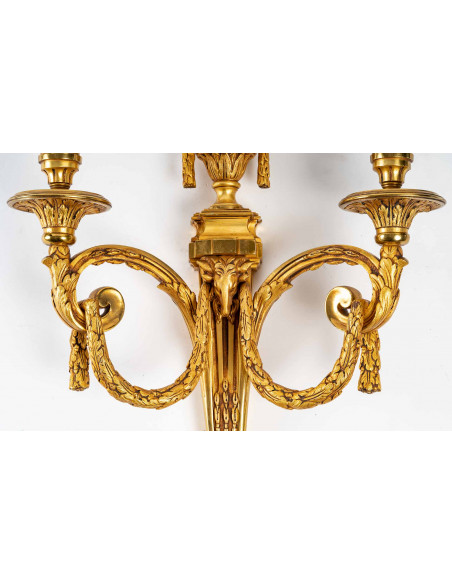 Suite de cinq appliques de style Louis XVI.