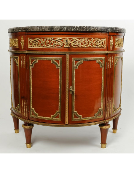 A Louis XVI style demi-lune commode. 19th century.